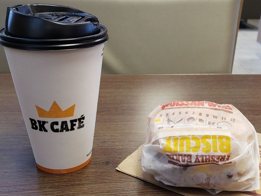 A coffee and a Burger King Crossan'wich sandwich in the wrapper