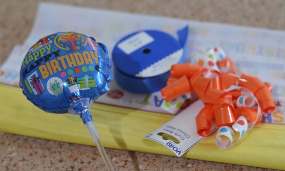 Candy bouquet diy supplies including a birthday balloon