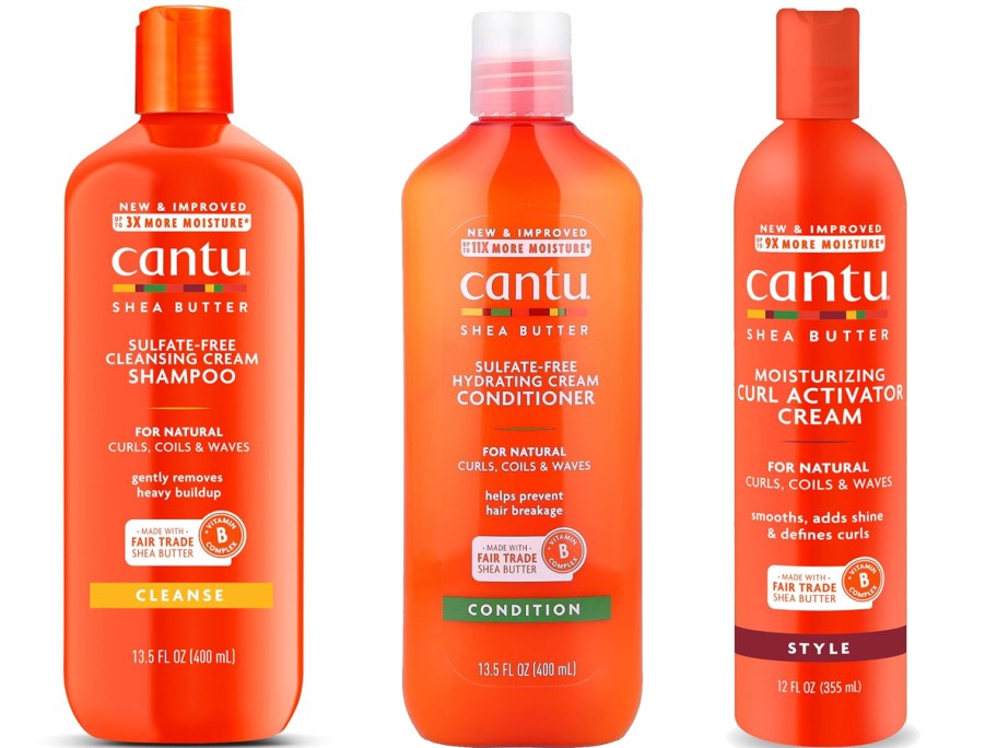three orange bottles of Cantu shampoo, conditioner, and curl cream