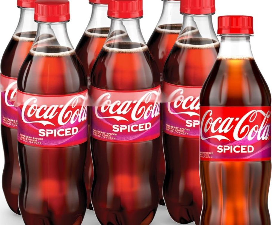 Stock image of a 6-pack of Coca-Cola Spiced 16.9oz bottles