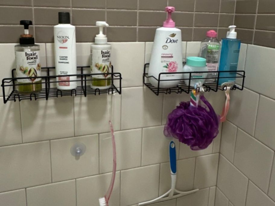 Coraje Adhesive Bathroom Caddy 2-pack hanging on shower wall with Shampoo and soap in them 