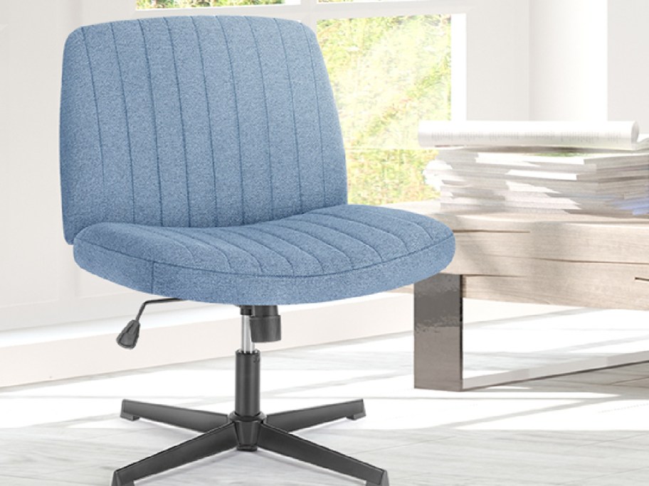 Criss cross office chair in blue displayed in an office
