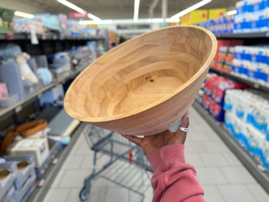A hand holding a Crofton Oversized Serving Bowl in Aldi