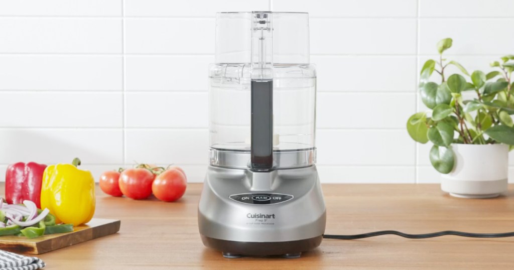 Cuisinart Prep 9 Food Processor on a counter top with vegetables near it