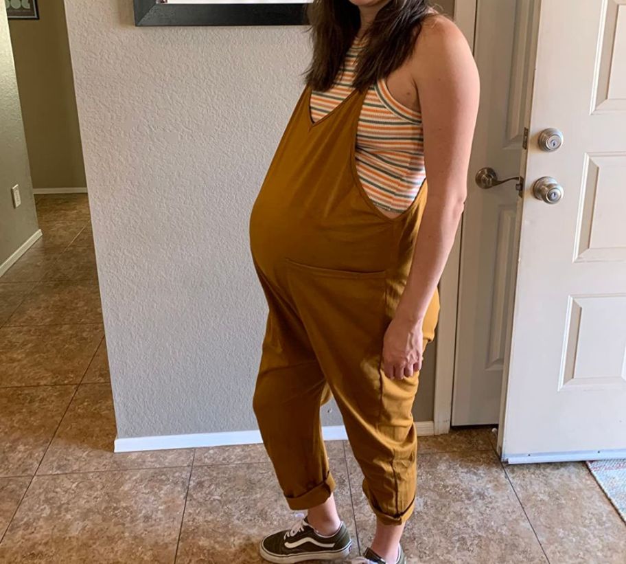  An expectant mom wearing a DEEP SELF Women's Sleeveless Jumpsuit