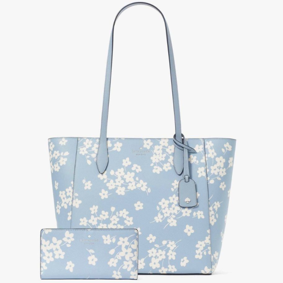 a light blue floral tote and matching bifold wallet