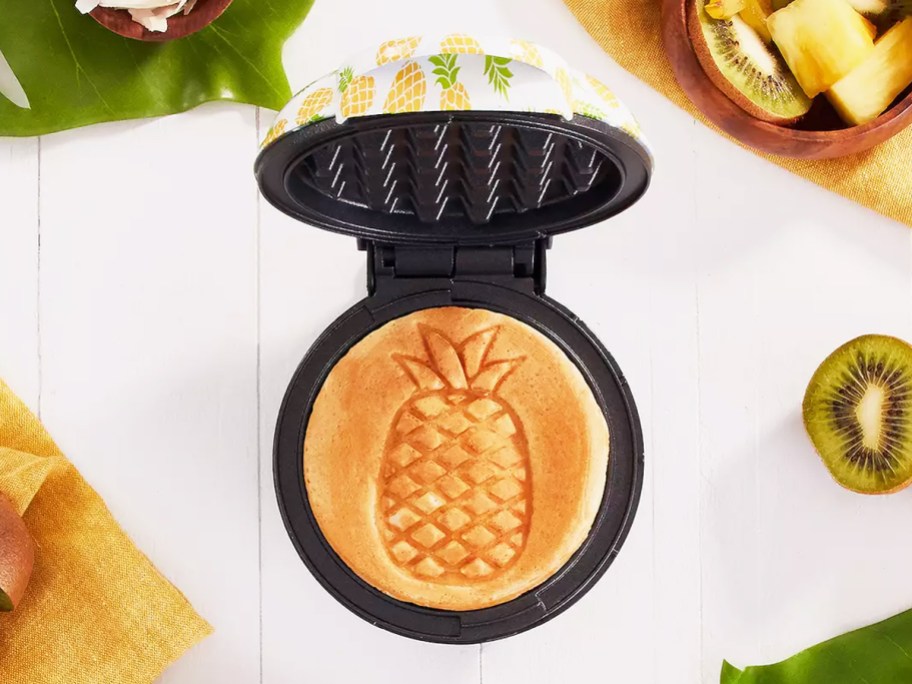 pineapple print waffle sitting on a mini waffle maker