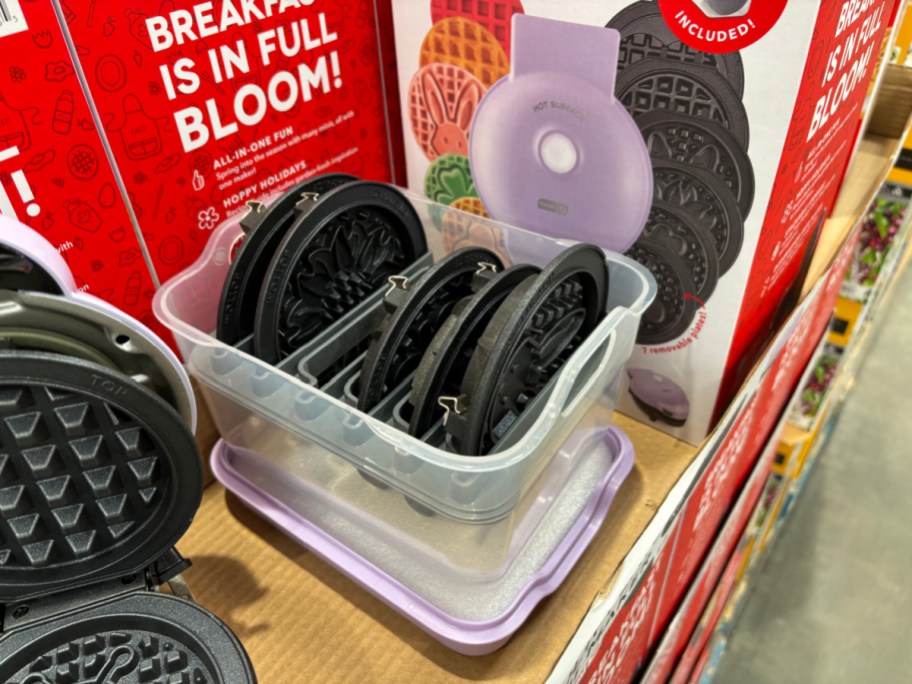 Dash Waffle maker plates in storage case on display at costco