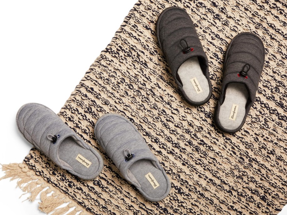 light and dark grey pairs of men's slippers on rug