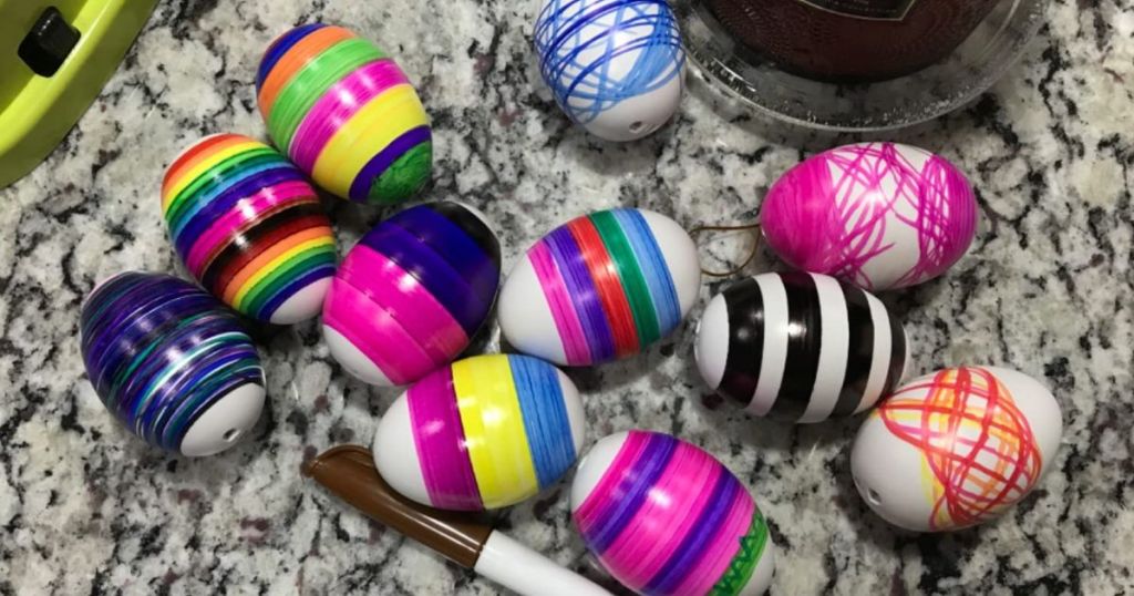A table full of decorated Easter eggs
