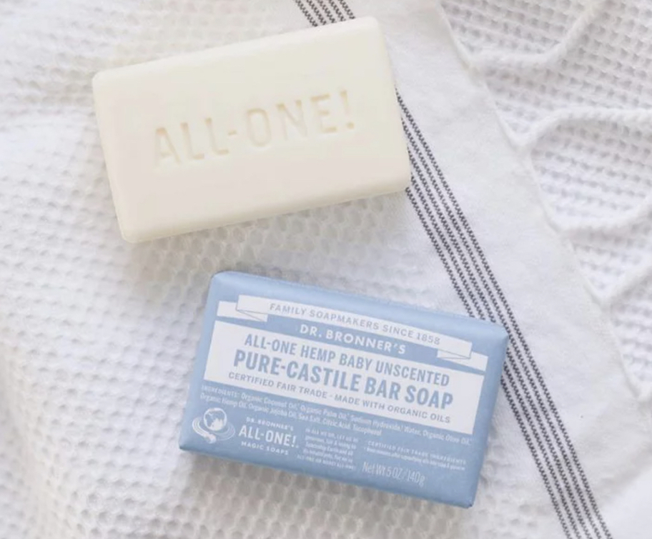 Pack of Dr. Bronner's unscented baby bar soap on towel