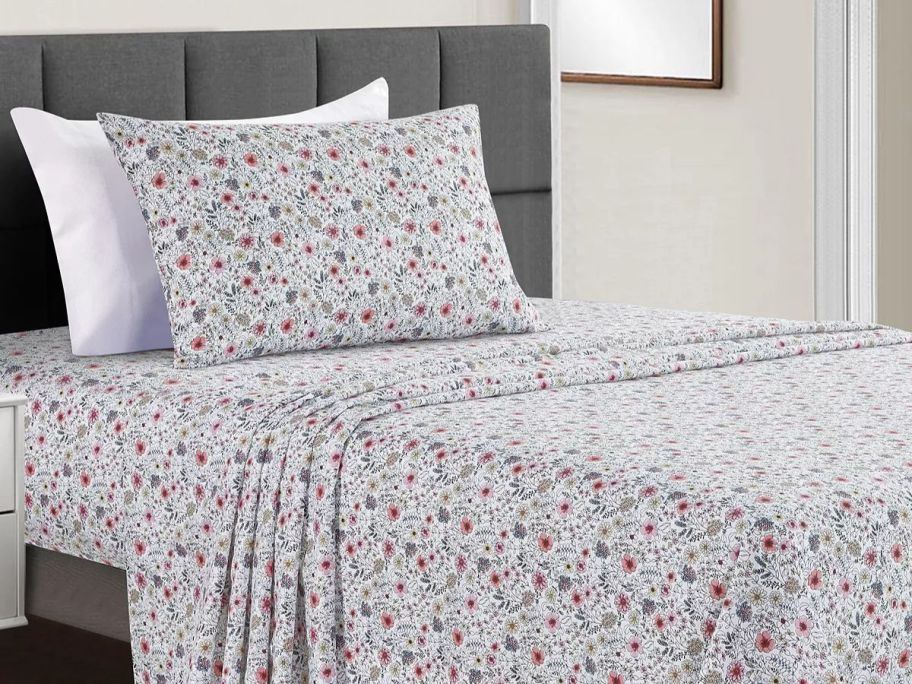 a set of floral printed sheets on a twin bed