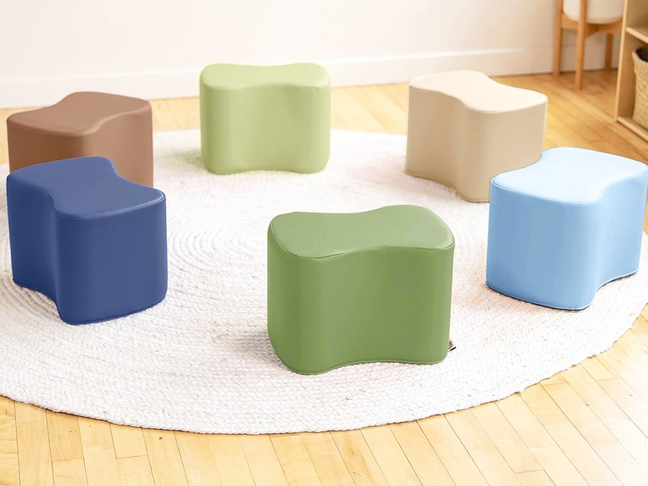 6 colorful toddler stools on round rug