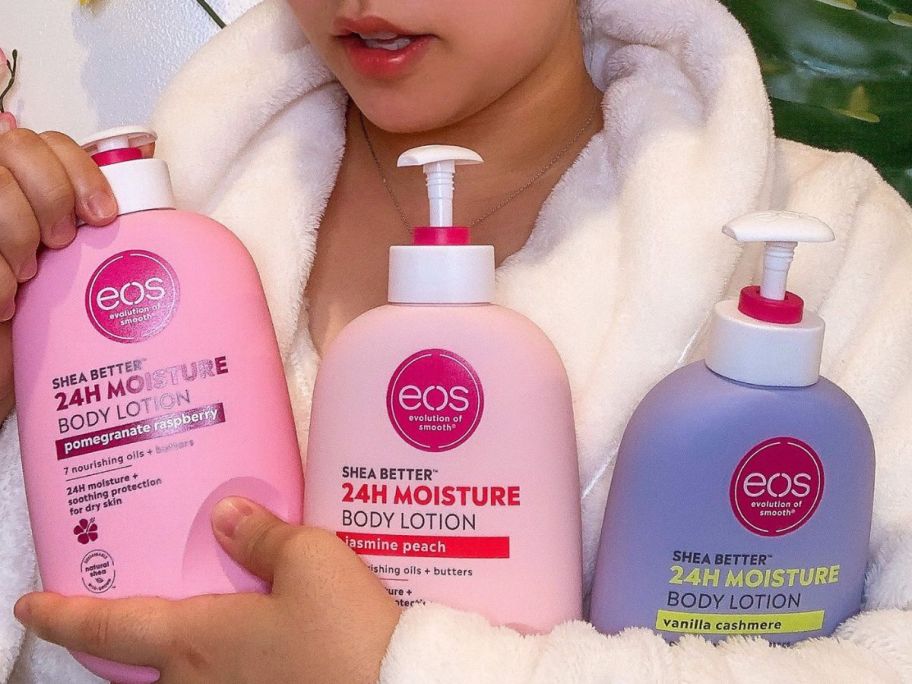 bottles of eos lotion being held in arms