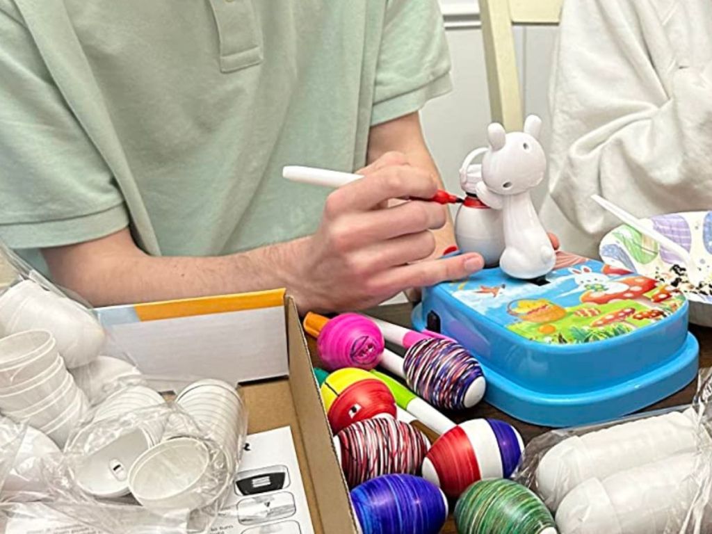A man using an Easter Egg Decorating Kit