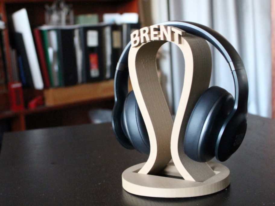customized name headphone stand with headphones on it