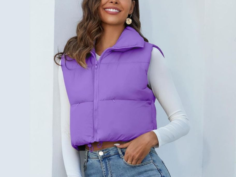 A woman wearing a Flygo Cropped Puffer Vest in purple