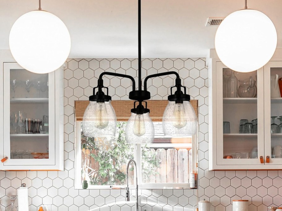 3 light chandelier over kitchen island
