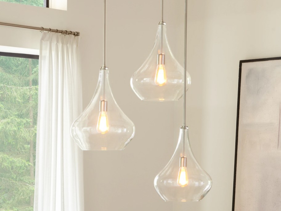 clear glass bell lights hanging in dining room