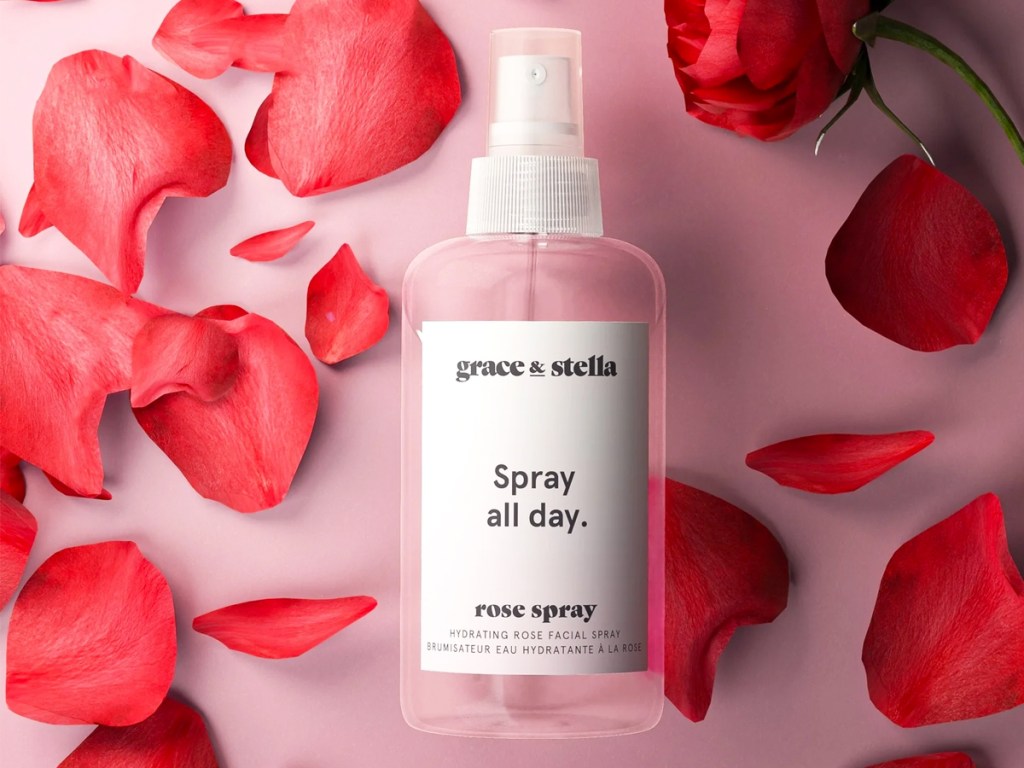 bottle of Grace & Stella Rose Water Facial Spray surrounded by rose petals