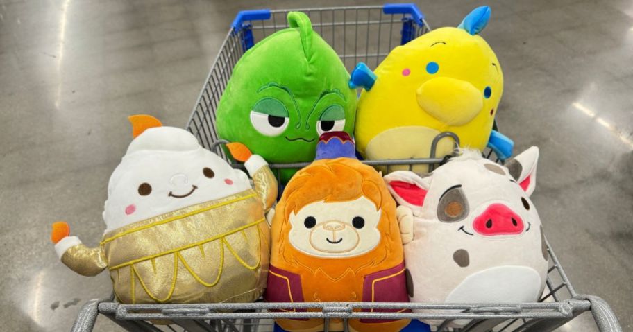 various Disney Squishmallows sitting in a Walmart shopping cart