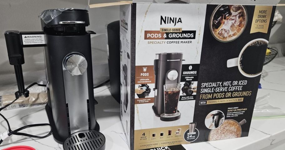 Ninja Pods & Grounds Specialty Single-Serve Coffee Maker on counter beside of box it came in