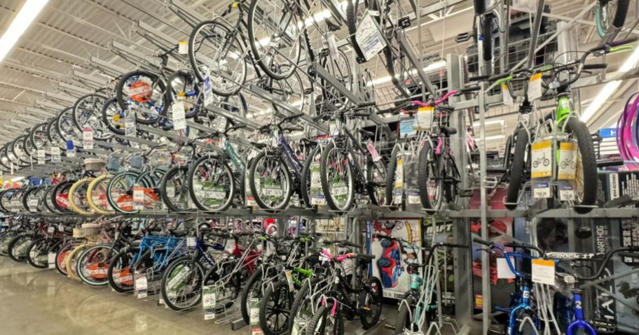various bicycles for kids and adults on display wall at Walmart