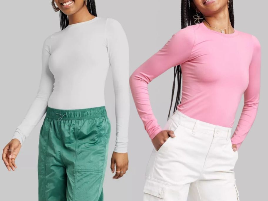 woman wearing a white long sleeve fitted shirt with green pants and woman wearing pink long sleeve tee with white pants