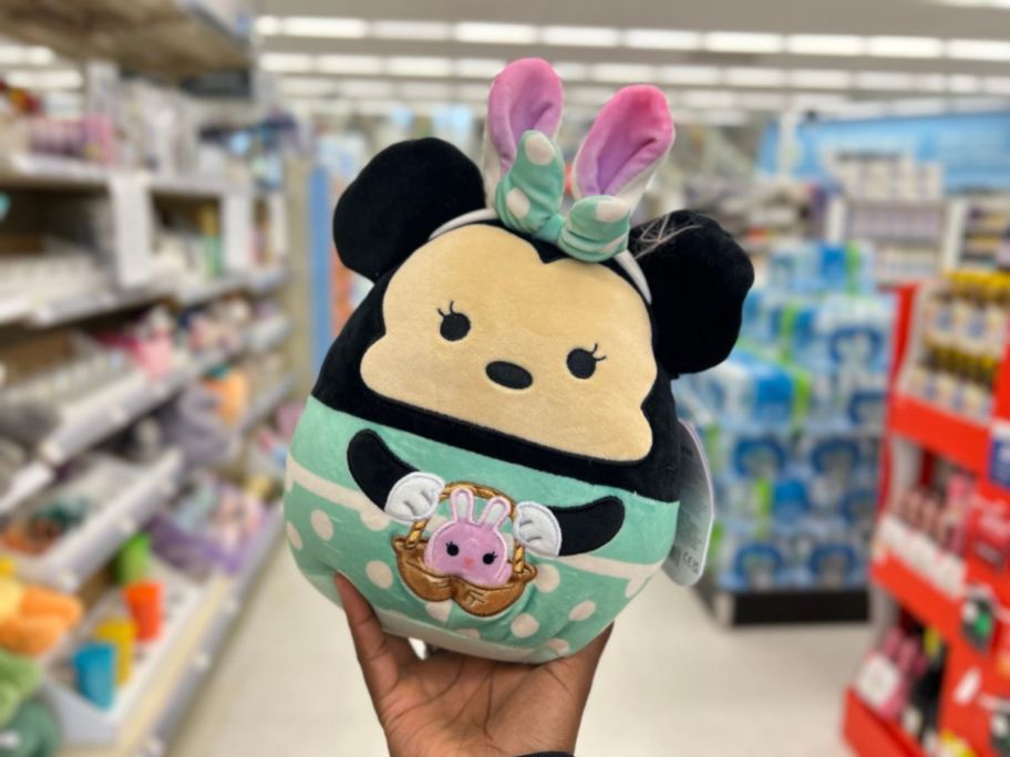 hand holding a Squishmallows Disney Minnie Mouse with Bunny Ears