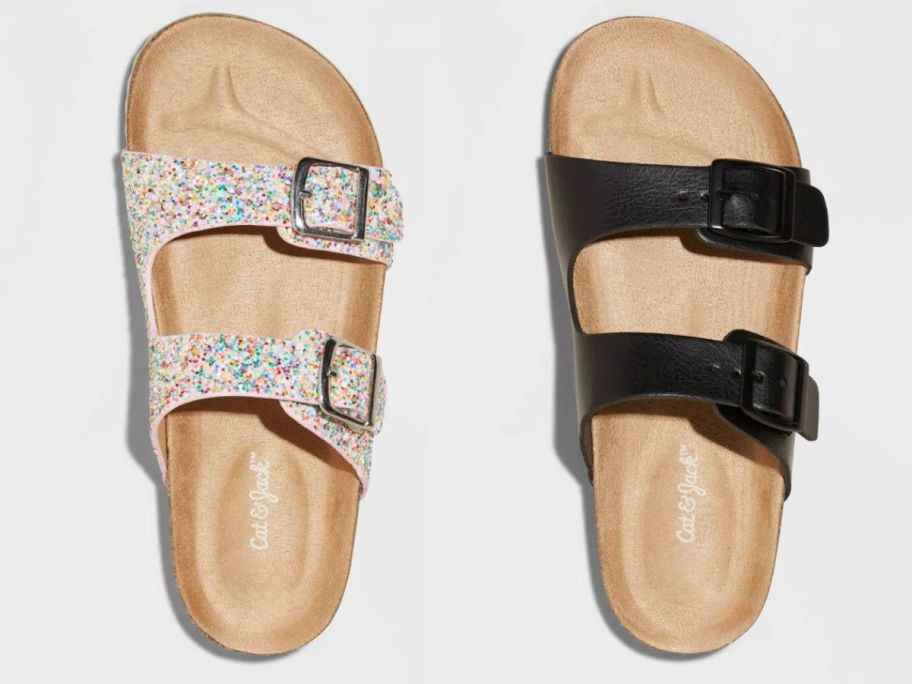 kid's footbed sandals with tan soles, one with floral buckle straps and the other with black buckle straps