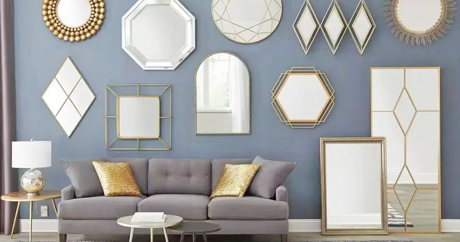 multiple mirrors on wall above couch