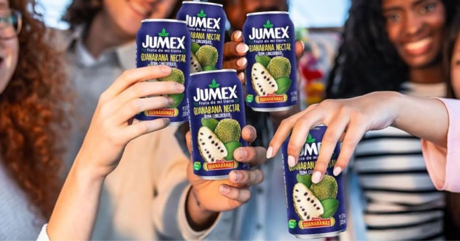 Several women holding cans of Jumex Nectar