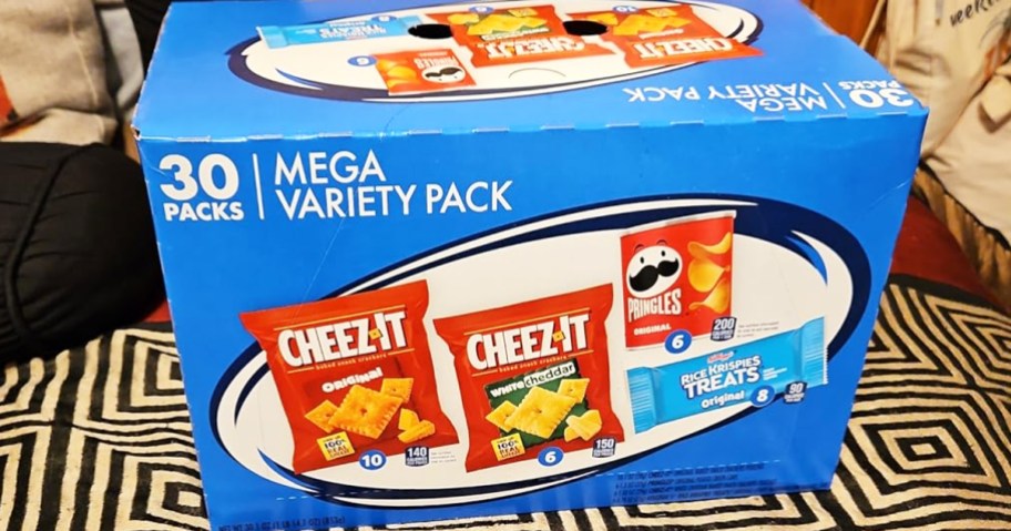 blue box of kellogg's snacks on a bed