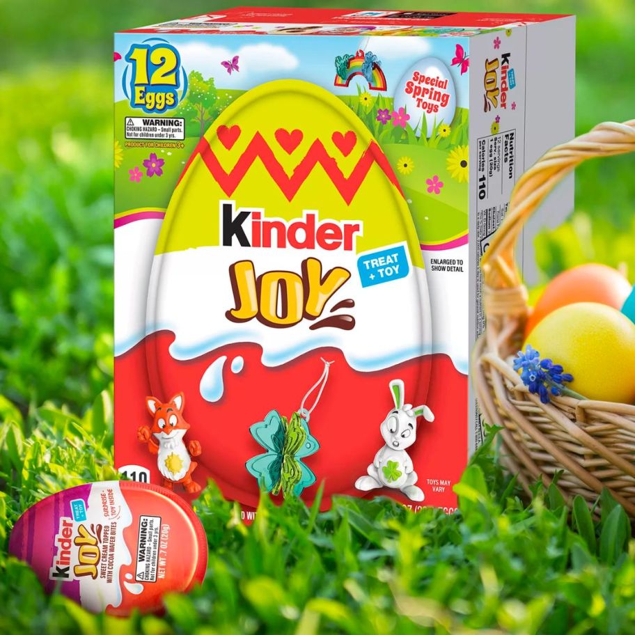 a 12 pack box of surpise eggs, sitting on grass net to an easter baskets