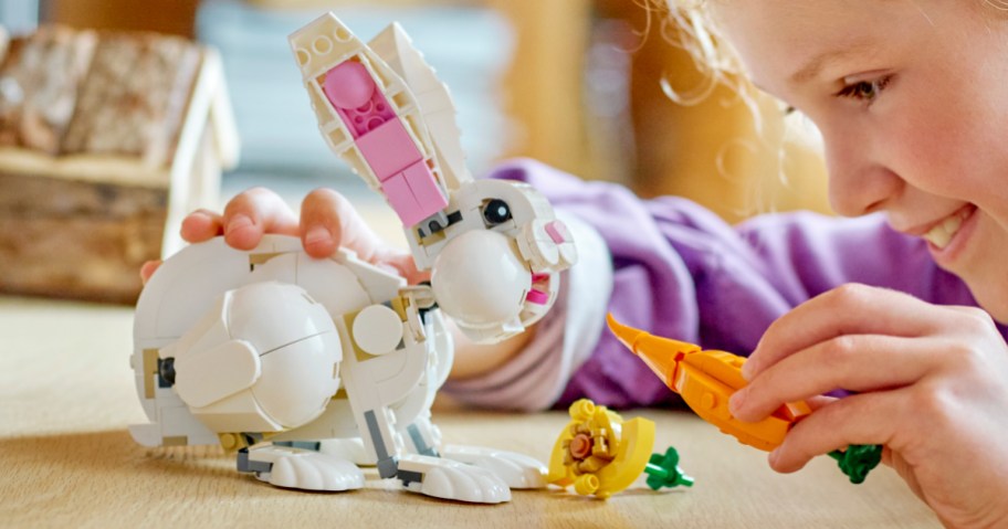 Child playing with LEGO Creator Rabbit