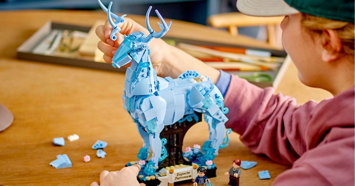 Kid building the Lego Harry Potter Expecto Patronum Set