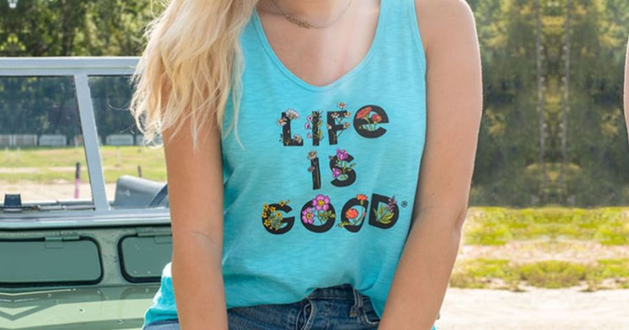 woman wearing a life is good tank top