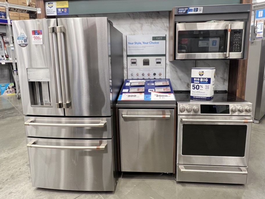 stainless steel fridge, dishwasher, range, and microwave on display at lowe's