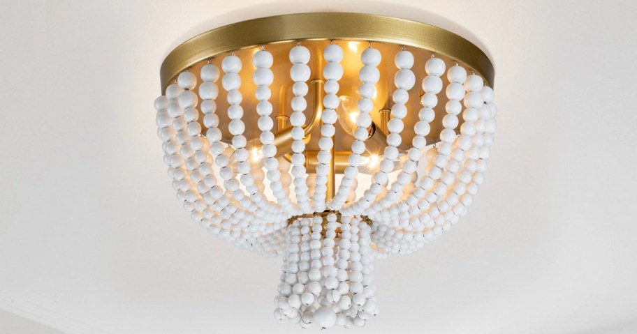 white and gold beaded flush mount light fixture