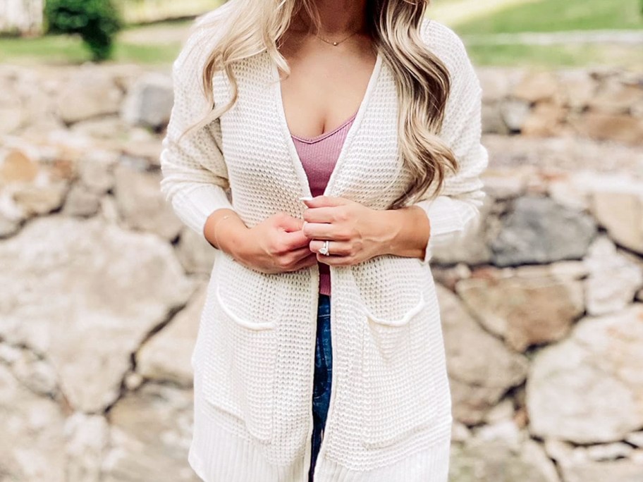 woman wearing a white waffle knit cardigan