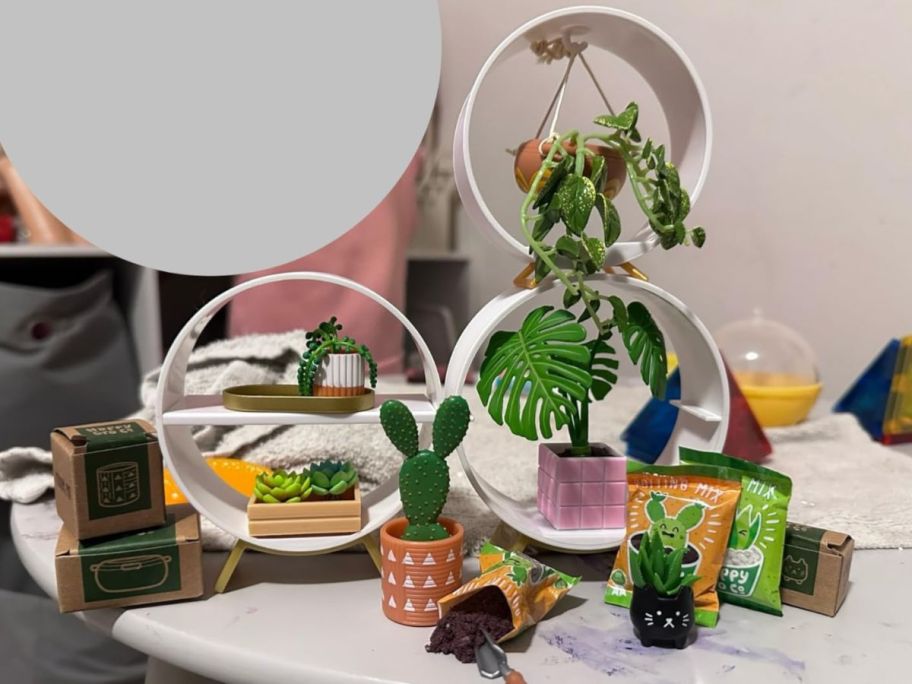 MGA Miniverse Home Series with several little plants and bags of soil displayed on the packaging that doubles as mini shelves