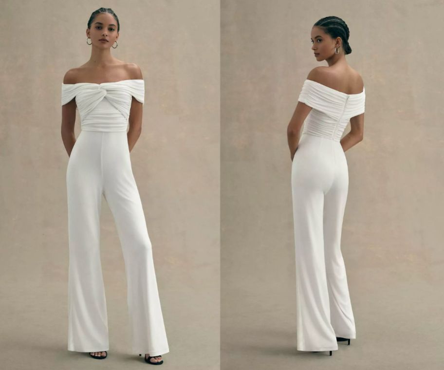 a woman wearing a white off the shoulder wide leg jumpsuit