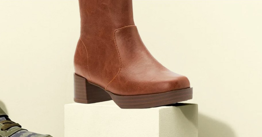 brown boot on pedestal 