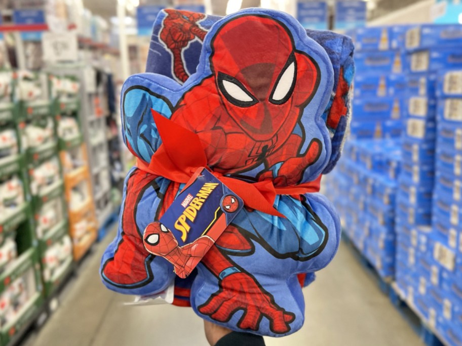 hand holding up Spider-Man Pillow and Throw Set