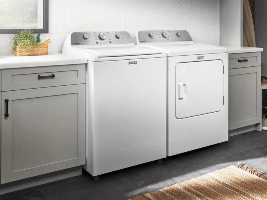 white washing machine and dryer pair in laundry room