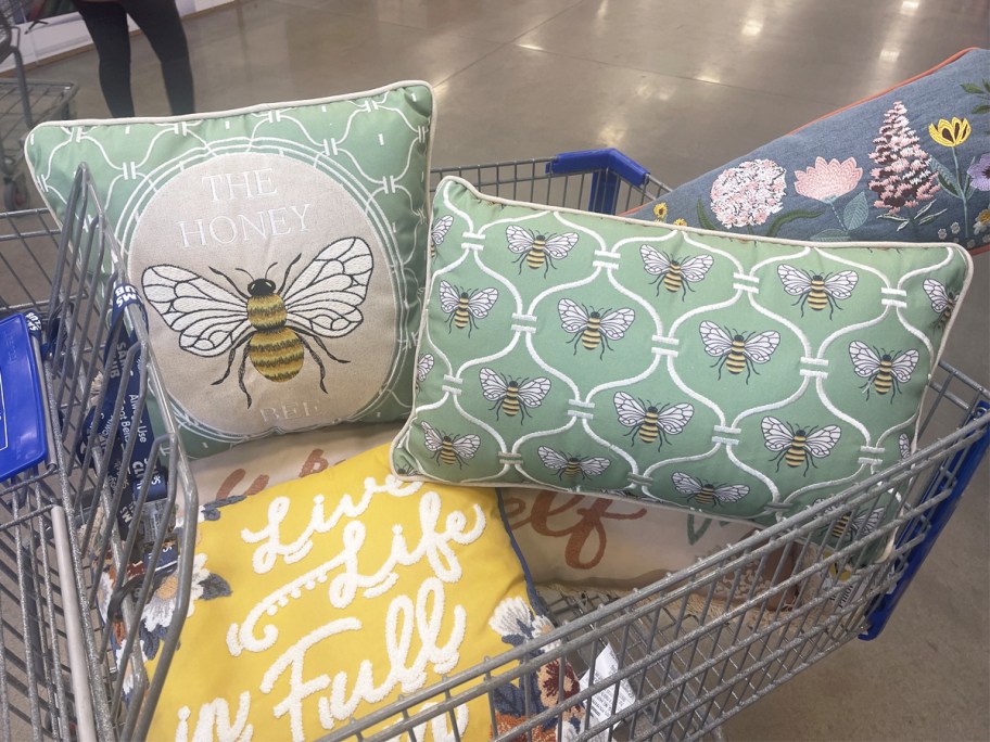 spring throw pillows in a shopping cart