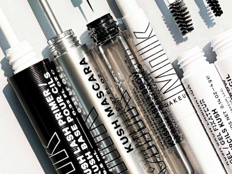opened tubes of milk makeup mascara and brow products