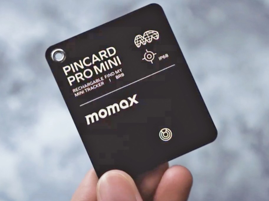 hand holding up Momax Pincard Rechargeable Bluetooth Tracker