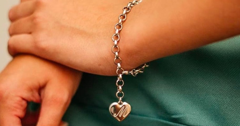 Monily Girls Initial Stainless Steel Charm Bracelet being worn by a girl