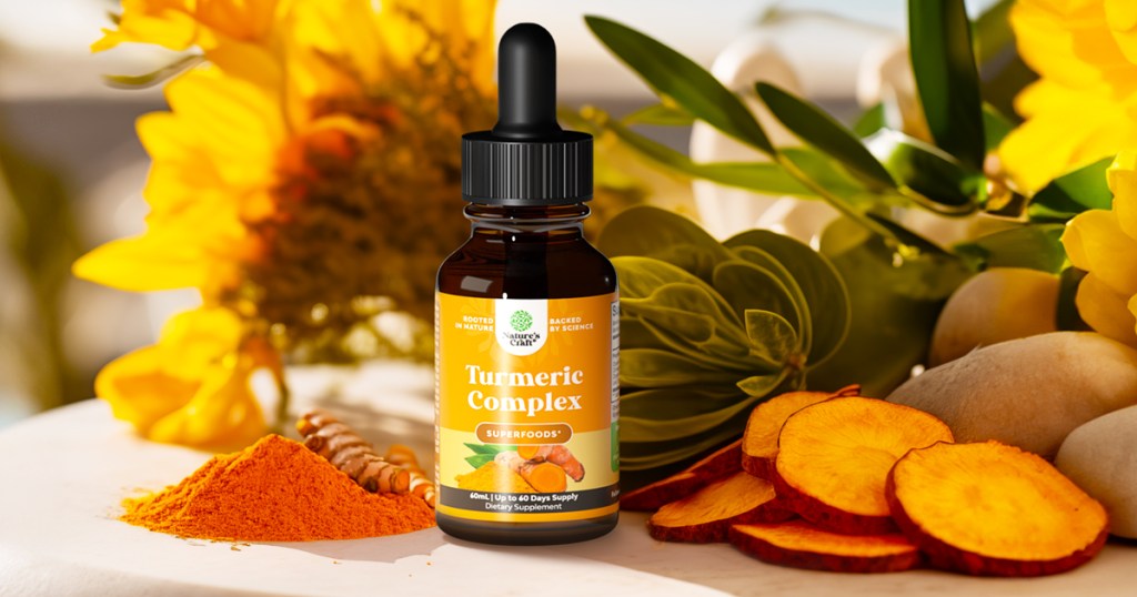 bottle of Nature's Craft Liquid Turmeric on table near tumeric powder and roots